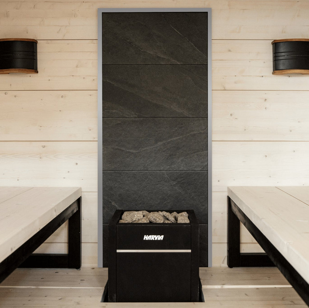 Harvia electric sauna heater with black facade and stone compartment filled with rocks