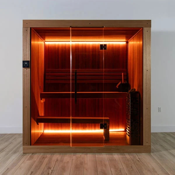 Infrared-style studio sauna with glowing wood interior, glass front, benches and controls.