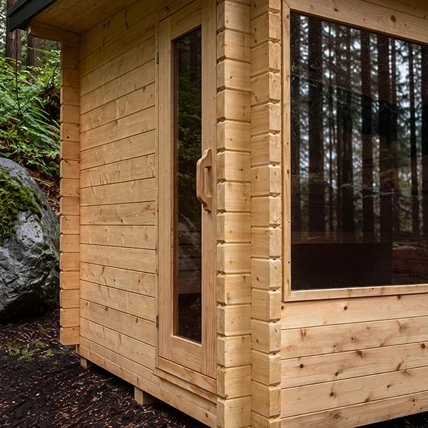 Wood sauna cabin with glass window and solid door on the side