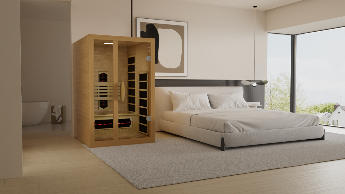 Wood infrared sauna cabin with open door next to bedroom setting