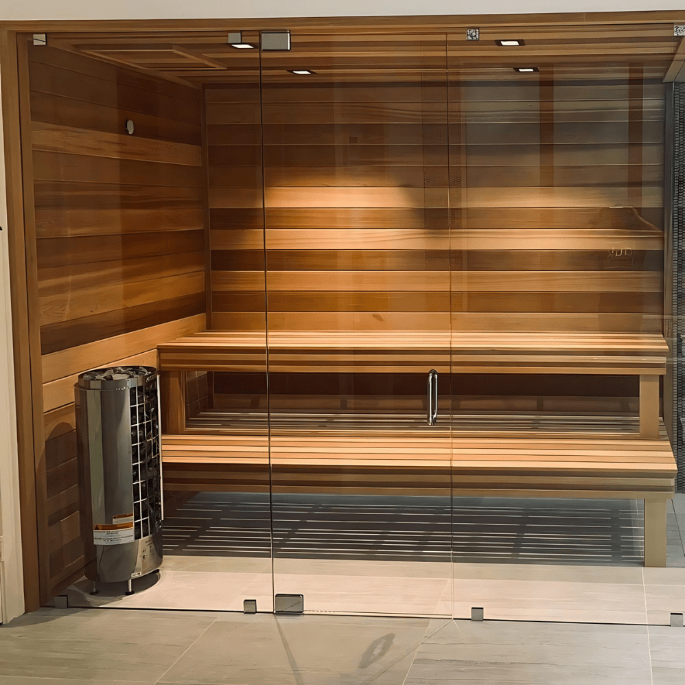 Sauna room interior with wooden benches and a cylindrical heater unit