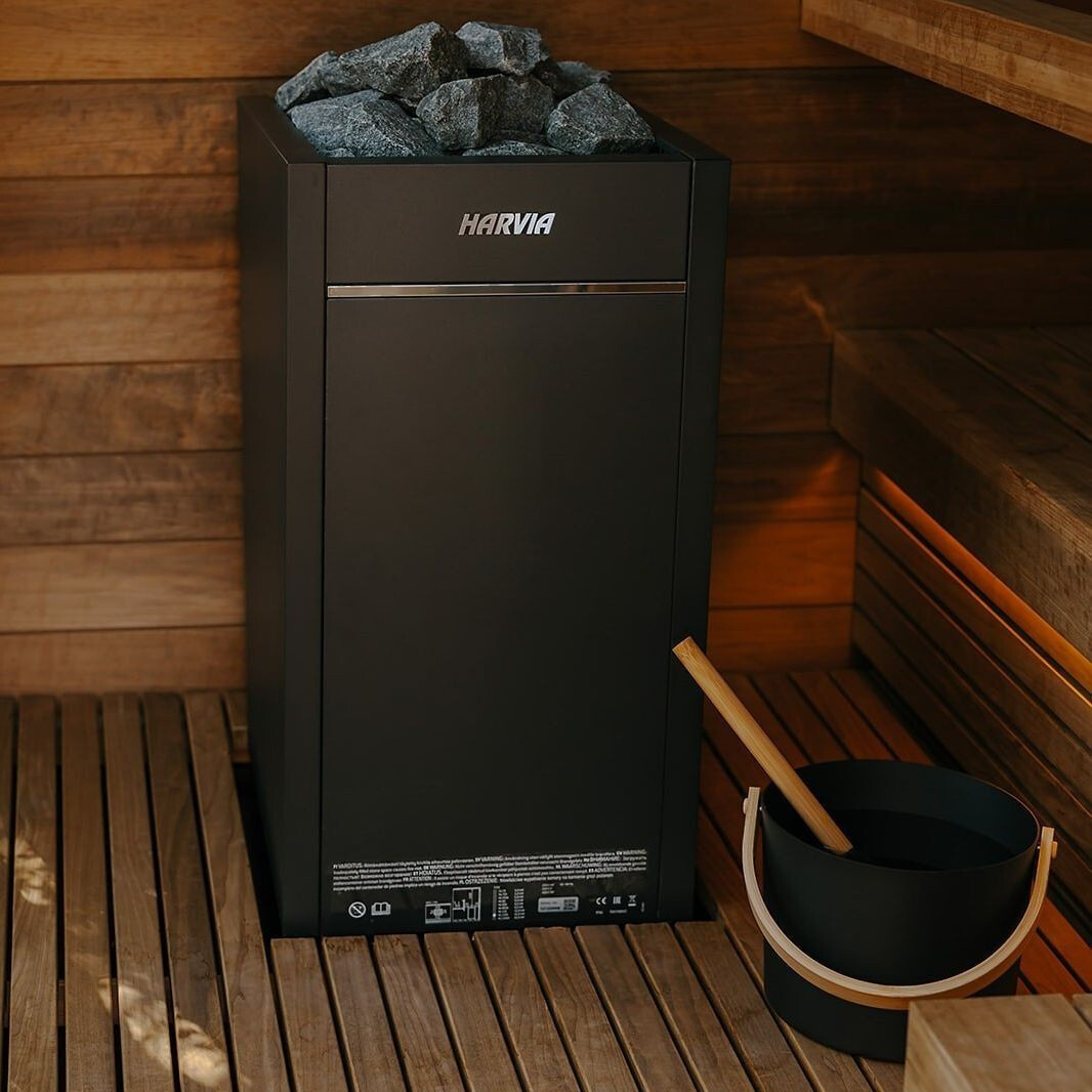 Dark gray Harvia electric sauna heater with dark stones on top