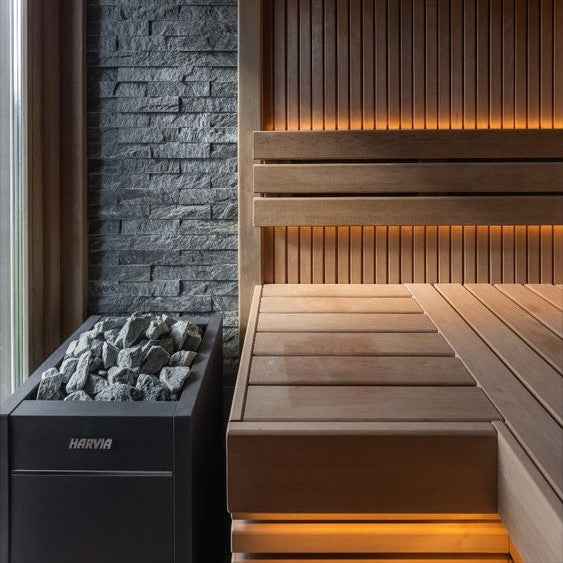 Electric sauna heater with stone box in a wooden sauna