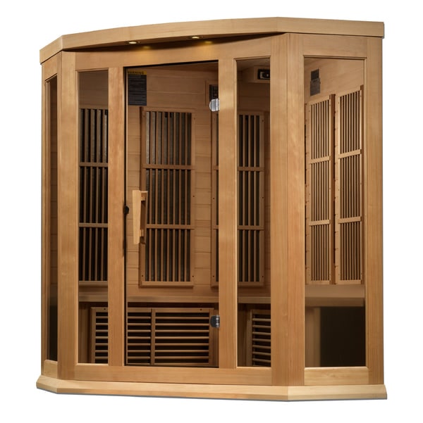 Corner wooden infrared sauna with tall slat walls, door panel, and bench platform